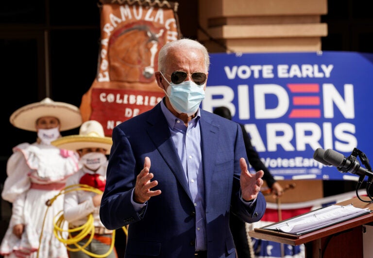 Members of a mariachi band look on as Joe Biden discusses the disproportionate ways coronavirus has impacted Latinos in Nevada during a campaign stop at the East Las Vegas Community Center in Las Vegas on Oct. 9.