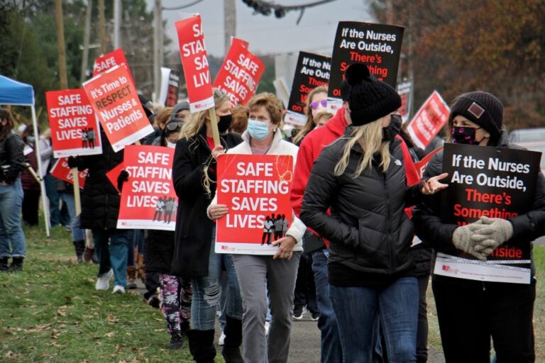 Nurses picket at the entrance to St. Mary Medical Center in Langhorne, Pa. About 800 nurses went on strike Tuesday citing long simmering grievances over wages and staffing levels. (Emma Lee/WHYY)