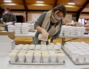 Jayne Clauss pours servings of gravy at St. Robert Bellarmine Church