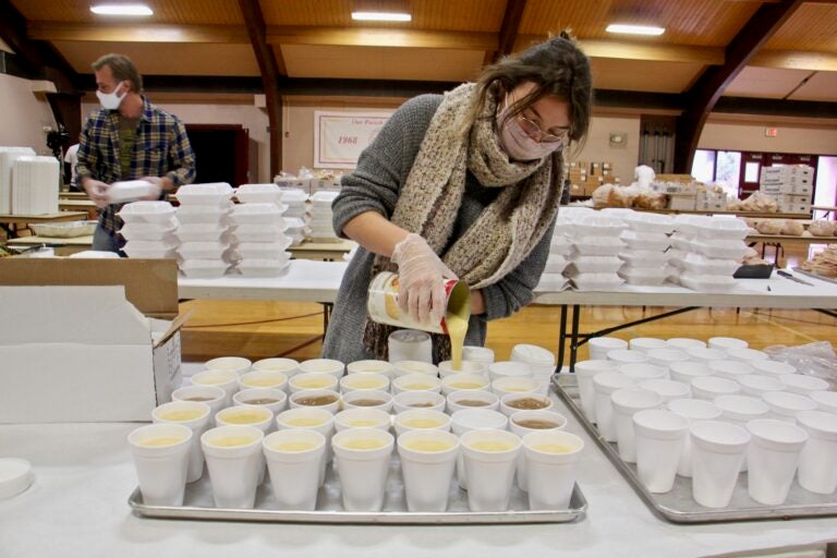 Jayne Clauss pours servings of gravy at St. Robert Bellarmine Church