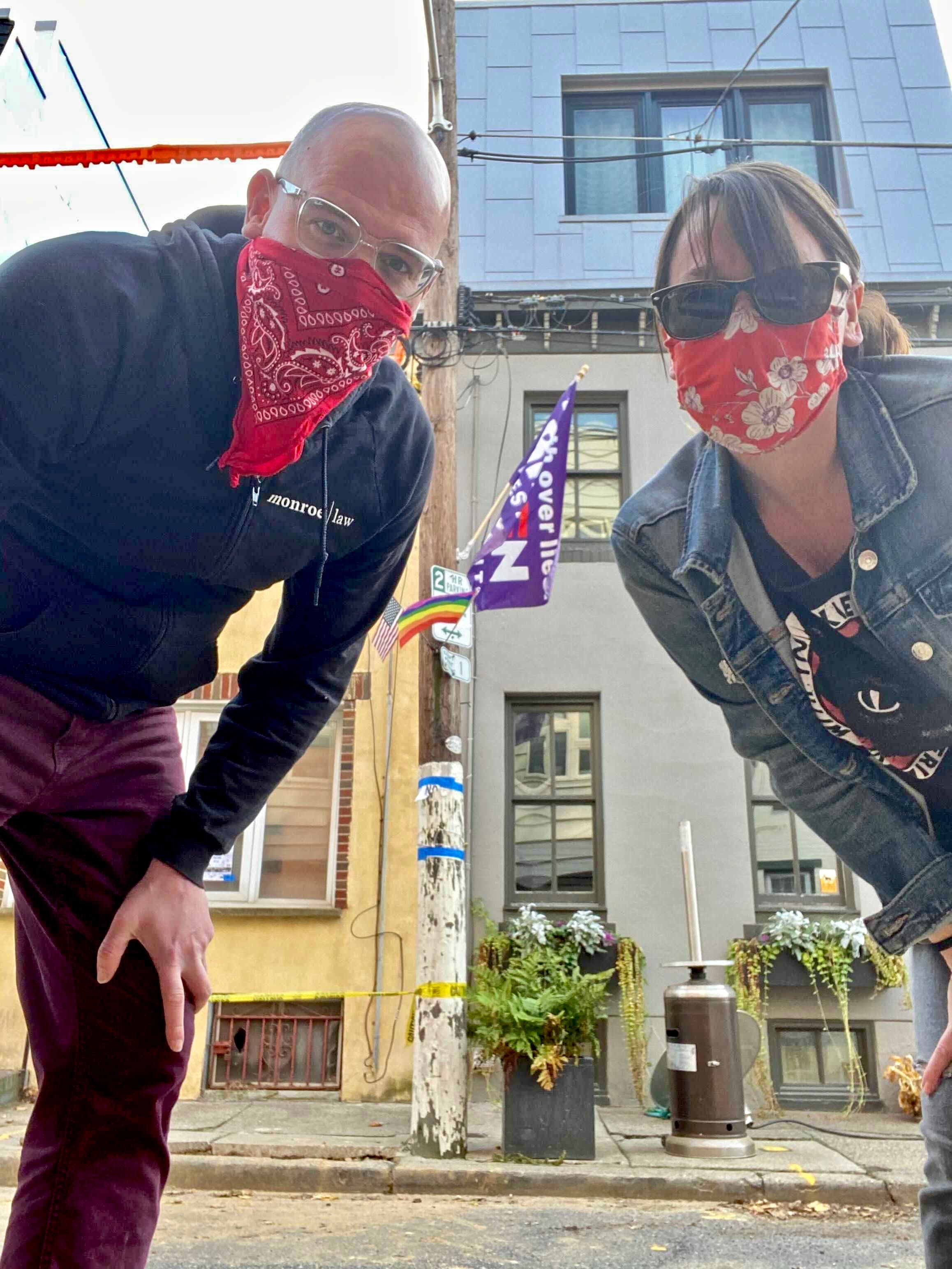 Matty Monroe and their wife, Jen Hope, set up a propane heater for an outdoor Thanksgiving on their block.