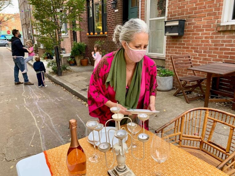 Martha Rich sets up tables to share with her neighbors on her street in South Philly.