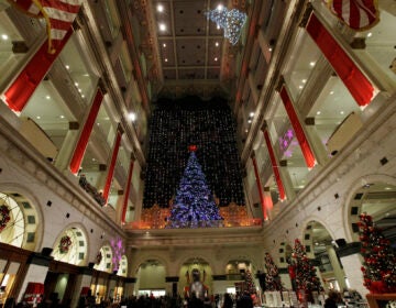 FILE - holiday lights are seen at Macy's in Philadelphia. The Wanamaker Grand Court Organ, installed nearly 100 years ago in this location, is the largest operational pipe organ in the world. (AP Photo/Matt Rourke)
