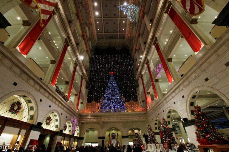 FILE - holiday lights are seen at Macy's in Philadelphia. The Wanamaker Grand Court Organ, installed nearly 100 years ago in this location, is the largest operational pipe organ in the world. (AP Photo/Matt Rourke)