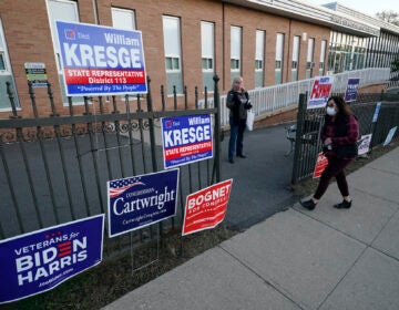 A voter arrives to cast her ballot at the Charles Sumner Elementary School on Election Day, Tuesday, Nov. 3, 2020, in Scranton, Pa. (AP Photo/Mary Altaffer)