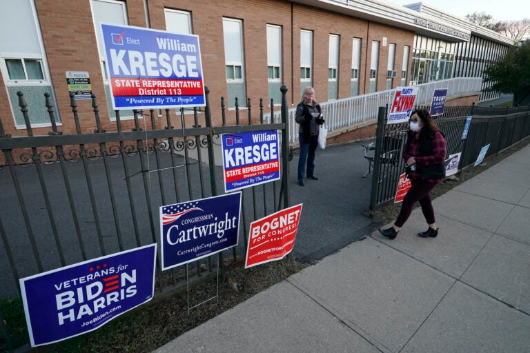 A voter arrives to cast her ballot at the Charles Sumner Elementary School on Election Day, Tuesday, Nov. 3, 2020, in Scranton, Pa. (AP Photo/Mary Altaffer)