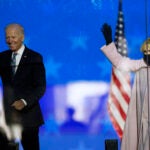 Democratic presidential candidate former Vice President Joe Biden and his wife Jill Biden wave to supporters, Tuesday, Nov. 3, 2020, in Wilmington, Del. (AP Photo/Andrew Harnik)