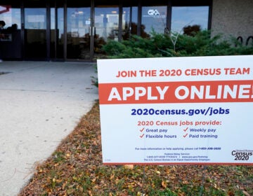 A sign is seen outside of IDES (Illinois Department of Employment Security) WorkNet center in Arlington Heights, Ill., Thursday, Nov. 5, 2020. Illinois reports biggest spike in unemployment claims of all states. (AP Photo/Nam Y. Huh)