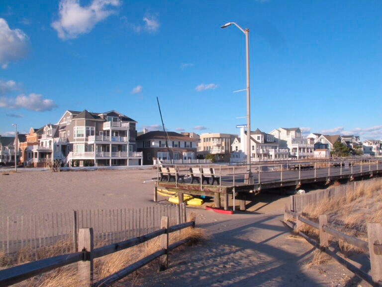 FILE -  This Jan. 16, 2020 file photo shows the end of the Ventnor, N.J. boardwalk as seen from Margate, N.J., where a group of residents want the city to build its own boardwalk. Voters rejected the proposal on Nov. 3.  (AP Photo/Wayne Parry, File)