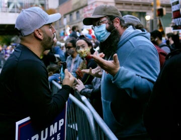 Protesters exchange points of view outside the Pennsylvania Convention Center where votes were being counted, Thursday, Nov. 5, 2020, in Philadelphia, following the Nov. 3 election. (AP Photo/Matt Slocum)