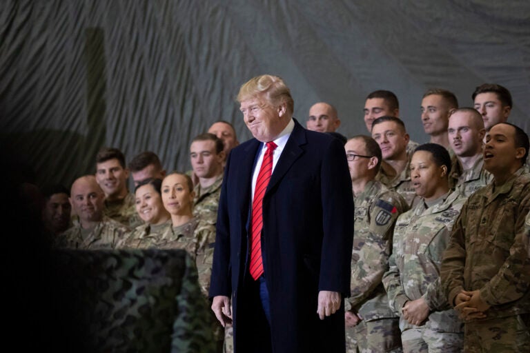 FILE - In this Nov. 28, 2019, file photo President Donald Trump smiles before addressing members of the military during a surprise Thanksgiving Day visit at Bagram Air Field, Afghanistan. (AP Photo/Alex Brandon, File)