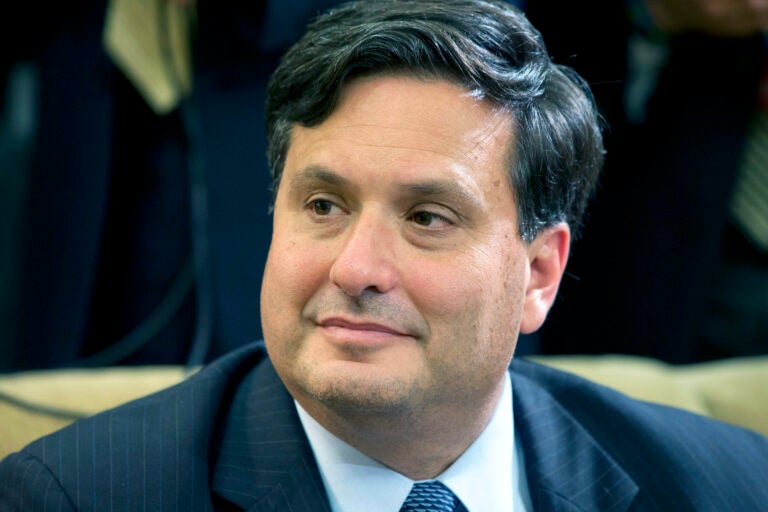 Ebola coordinator Ron Klain listens as President Barack Obama speaks to the media about the government’s Ebola response in the Oval Office of the White House, Wednesday, Oct. 22, 2014, in Washington. (AP Photo/Jacquelyn Martin)