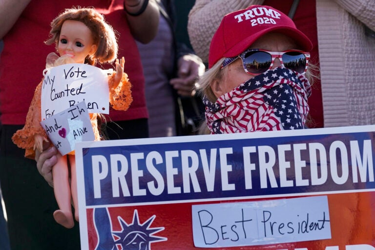 FILE- In a Nov. 7, 2020 file photo, a supporter of President Donald Trump is seen during a rally in Milwaukee after it was announced that the president was defeated by Democrat Joe Biden. President Trump will have to pay $7.9 million if he wants a statewide recount of unofficial results showing him losing to Biden by about 20,500 votes. The Wisconsin Elections Commission released the estimate on Monday, which was based on costs submitted by the 72 counties. (AP Photo/Morry Gash, File)