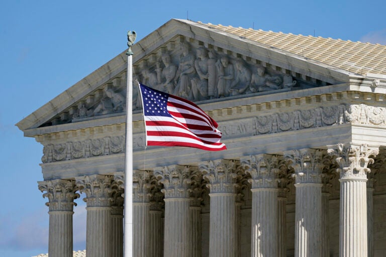 In this Nov. 2, 2020, file photo an American flag waves in front of the Supreme Court building on Capitol Hill in Washington. (AP Photo/Patrick Semansky)