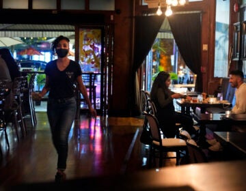 Patrons enjoy food and drink at The Brass Rail in Hoboken, N.J.