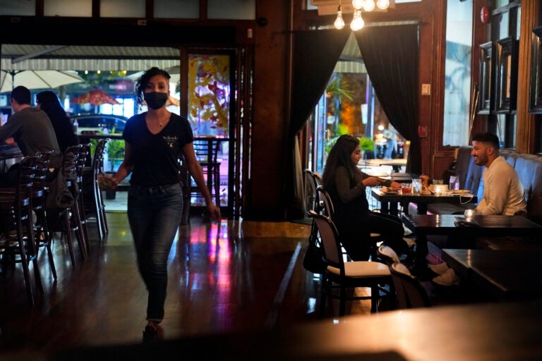 Patrons enjoy food and drink at The Brass Rail in Hoboken, N.J.