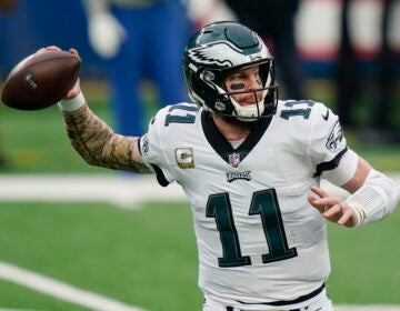 Eagles quarterback Carson Wentz throws a pass during the first half