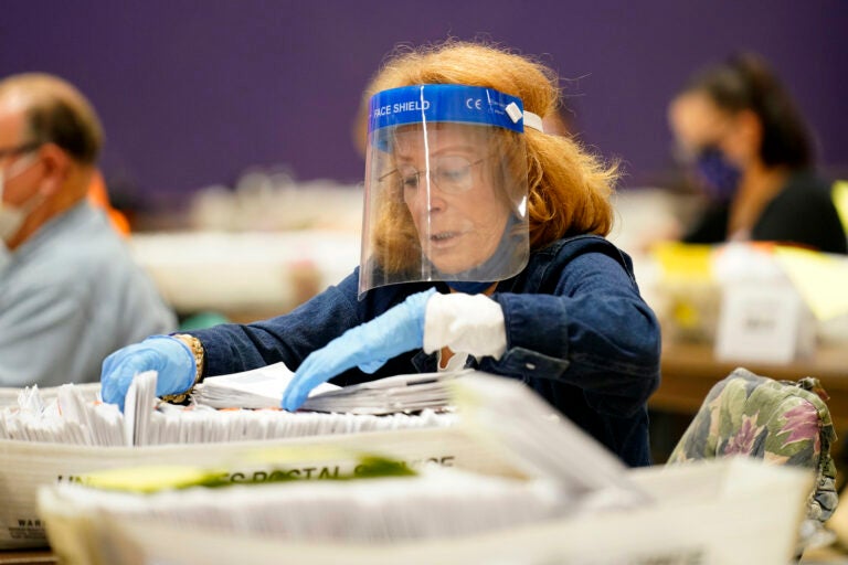 Paula Plotkin processes mail-in ballots at Bergen Community College