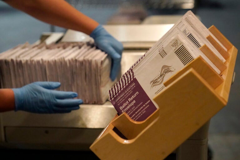 Envelopes containing ballots are shown at a voting center