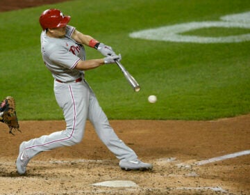 Philadelphia Phillies’ J.T. Realmuto bats during the second baseball game of a doubleheader against the Washington Nationals
