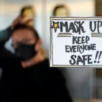 Manager Yllka Murati waits for a delivery driver to pick up takeout orders at the Penrose Diner