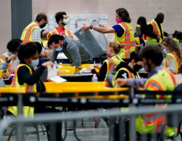 Philadelphia election workers process mail and absentee ballots for the 2020 general election