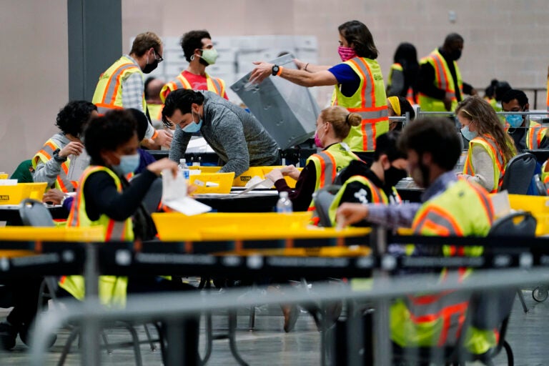 Philadelphia election workers process mail and absentee ballots for the 2020 general election