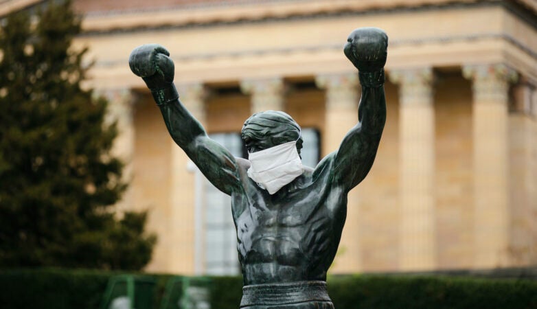 The Rocky statue is outfitted with a mock surgical face mask