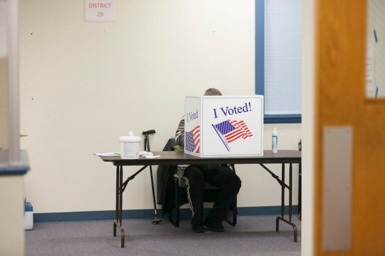 A voter fills out their ballot in Cherry Hill, N.J. on Nov. 3, 2020. (Miguel Martinez for WHYY)