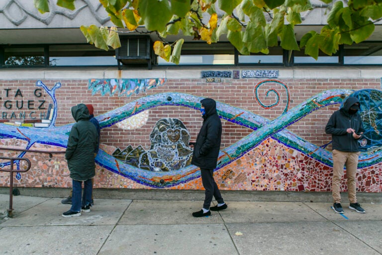 Voters practice social distance while lining up at polling place in Northern Liberties in Philadelphia.