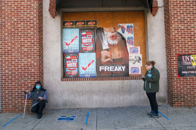 Voters practice social distance while lining up at polling place in Northern Liberties in Philadelphia on Election Day. (Miguel Martinez for WHYY)