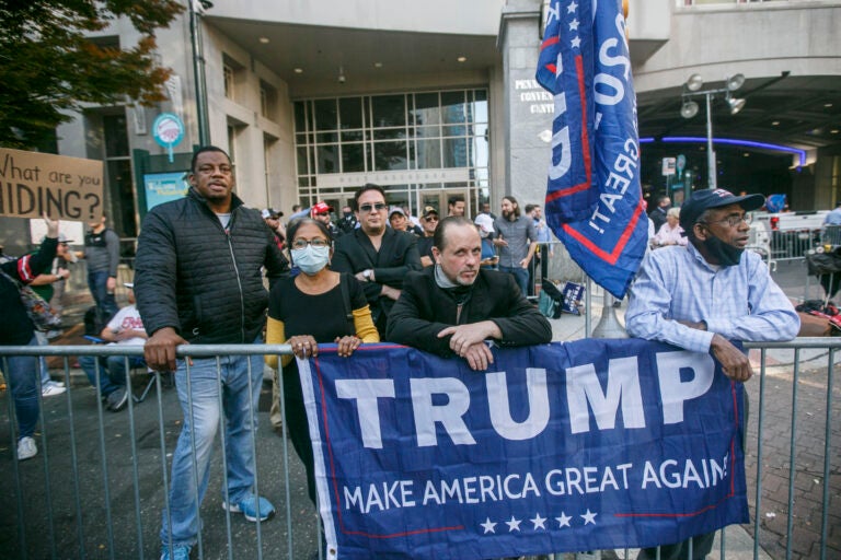 Trump supporters  outside the Convention Center after Joe Biden is projected to be the winner of the 2020 presidential election. (Miguel Martinez for WHYY)