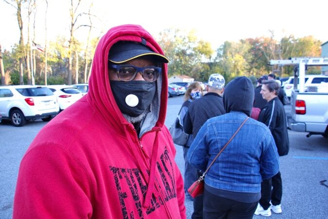 Gary Nelson waits to vote in a line that wraps around the Brookhaven Municipal Center in Brookhaven, Pa. (Emma Lee/WHYY)