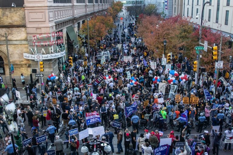 At 12th and Arch Streets in Philadelphia, protesters from both sides were separated by a line of police. (Kimberly Paynter/WHYY)