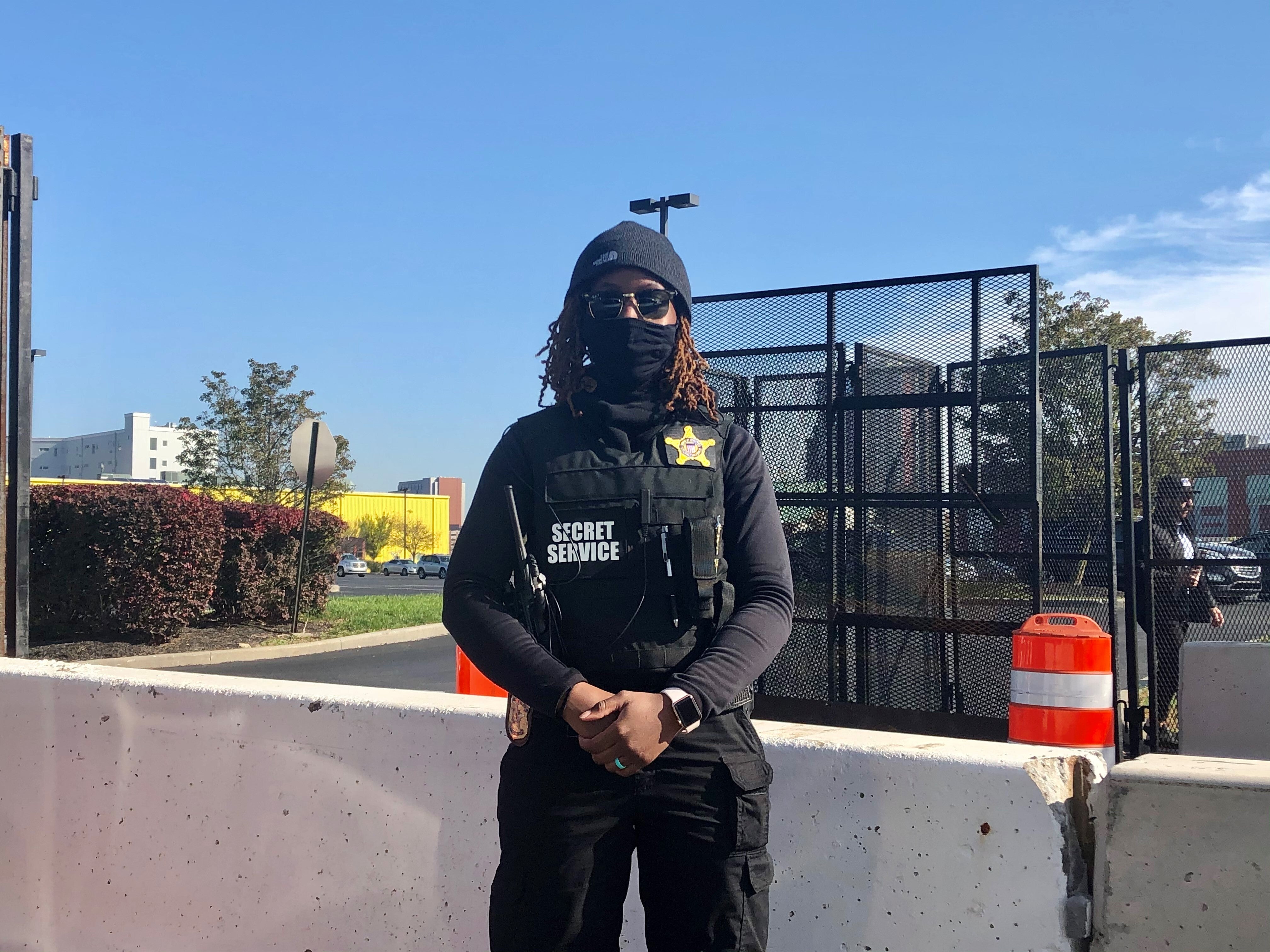 A Secret Service agent stands guard at the entrance to a heavily fortified section of road to the Chase Center on Wilmington's riverfront on Friday morning.