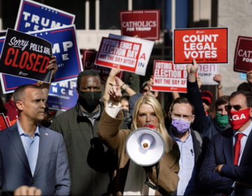 Former Florida Attorney General Pam Bondi speaks about a court order granting President Donald Trump's campaign more access to vote counting operations at the Pennsylvania Convention Center, Thursday, Nov. 5, 2020, in Philadelphia, following Tuesday's election. At left is Trump campaign advisor Corey Lewandowski. (AP Photo/Matt Slocum)