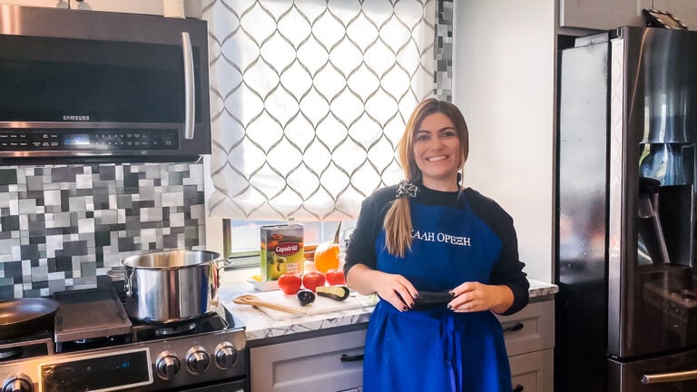 Mrs. Mylonas making stuffed baby eggplant