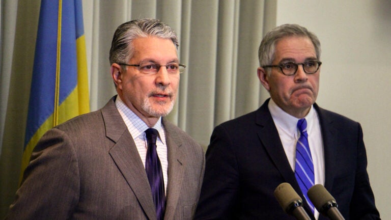 Anthony Voci speaks at a podium.