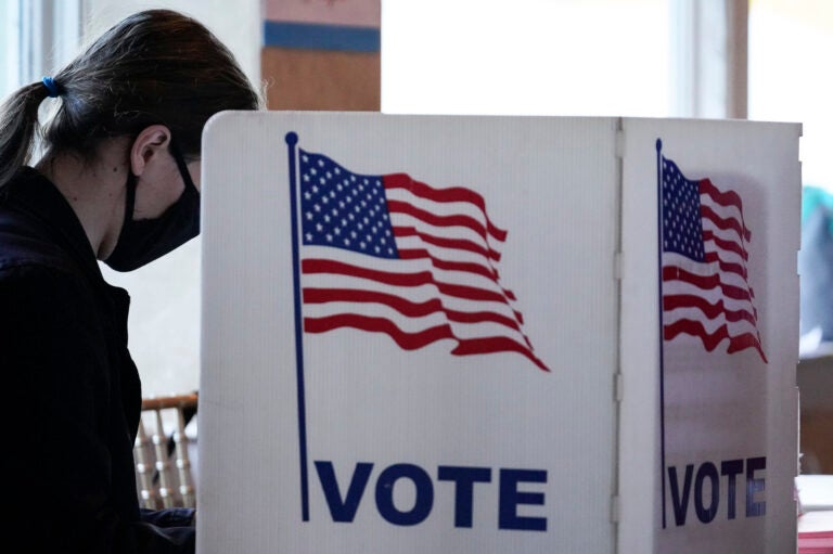 A voter casts a ballot on Election Day