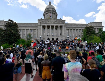 A crowd gathers for a rally to demand justice in the death of Breonna Taylor on the steps of the the Kentucky State Capitol in June. Taylor was killed in her apartment while Louisville police served a warrant. (Timothy D. Easley/AP Photo)