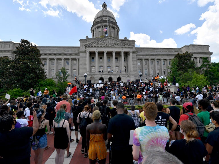 A crowd gathers for a rally to demand justice in the death of Breonna Taylor on the steps of the the Kentucky State Capitol in June. Taylor was killed in her apartment while Louisville police served a warrant. (Timothy D. Easley/AP Photo)