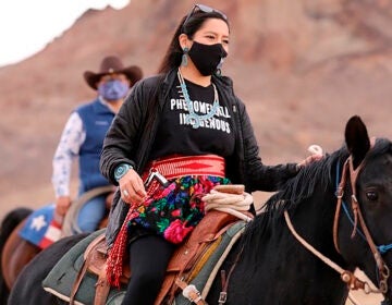 Allie Young, a Diné woman on the Navajo Nation in Arizona, is among a group of Native Americans riding on horseback to the polls on Election Day. (Larry Price/AP)