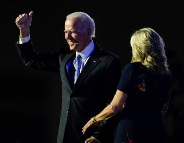 President-elect Joe Biden stands on stage with his wife, Jill Biden, on Saturday in Wilmington, Del. (Carolyn Kaster/AP Photo)