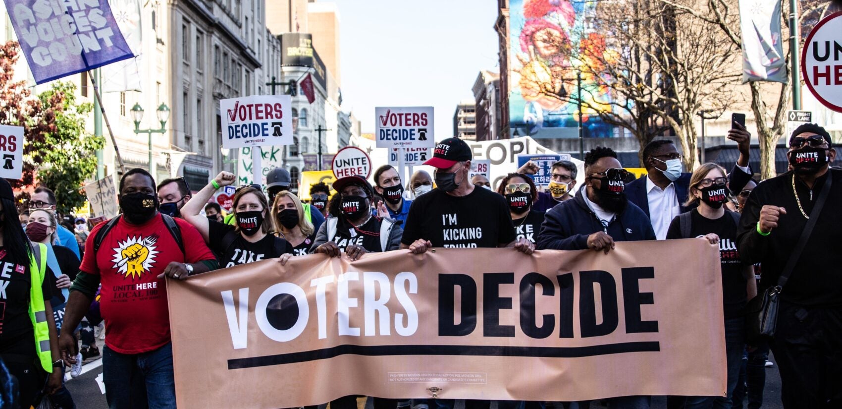 Demonstrators march through Center City Philadelphia to celebrate a Biden win.