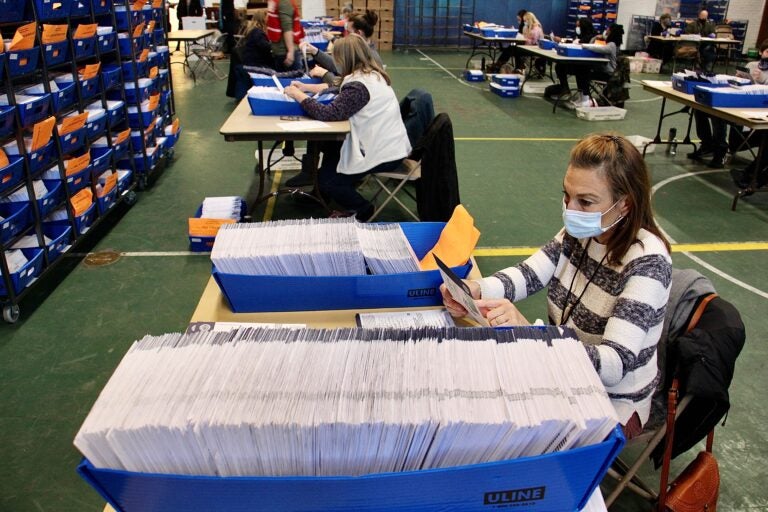 Chester Country election workers check ballots one last time before sending them to be scanned and counted