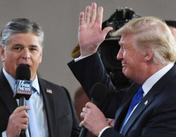 Fox News host Sean Hannity interviews President Trump in Las Vegas in 2018. Hannity, like Trump, has cast doubt on the 2020 election results without providing evidence. (Ethan Miller/Getty Images)