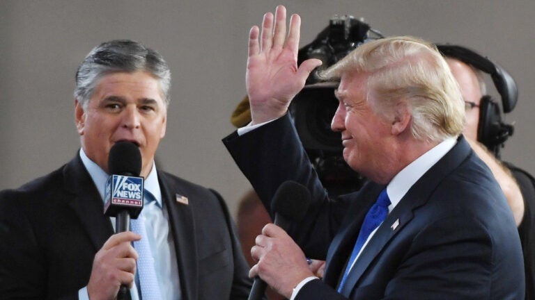 Fox News host Sean Hannity interviews President Trump in Las Vegas in 2018. Hannity, like Trump, has cast doubt on the 2020 election results without providing evidence. (Ethan Miller/Getty Images)