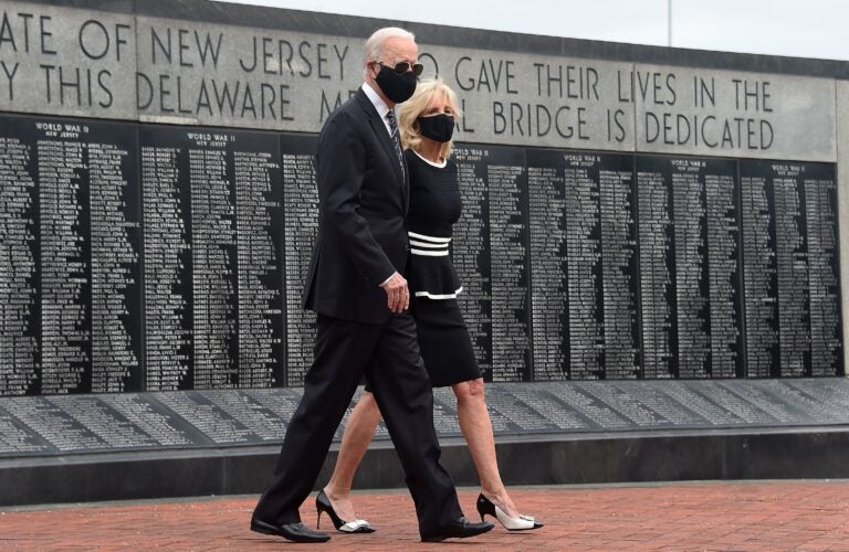 Joe Biden and his wife Jill Biden wear masks as they mark Memorial Day, on May 25. The president-elect has consistently worn masks amid the pandemic, and is calling for a national mask mandate. (Olivier Douliery/AFP via Getty Images)