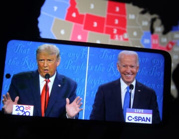 In this photo illustration the US President Donald Trump and Democratic presidential candidate and former US Vice President Joe Biden are seen during the final presidential debate displayed on a screen of a smartphone. (Photo Illustration by Pavlo Conchar/SOPA Images/LightRocket via Getty Images)