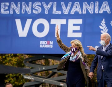 Joe Biden and his wife Jill Biden arrive for a drive-in campaign rally at Bucks County Community College on Oct. 24 in Bristol, Pa. Bucks County and three other suburban Philadelphia counties helped the president-elect win the swing state.